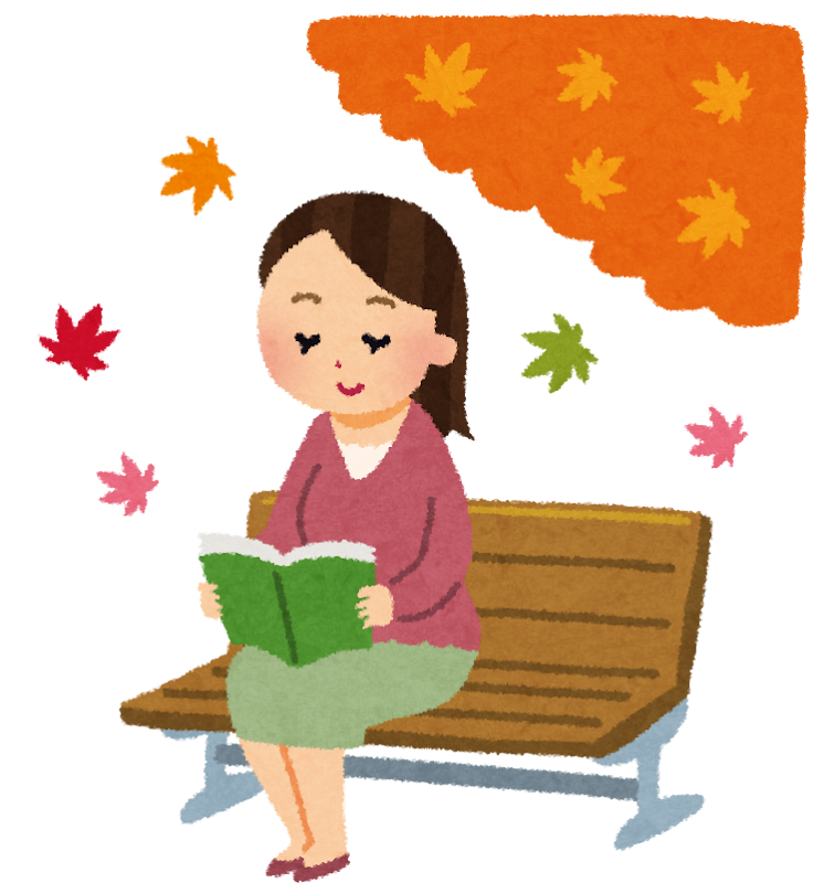 ベンチで本を読む女性